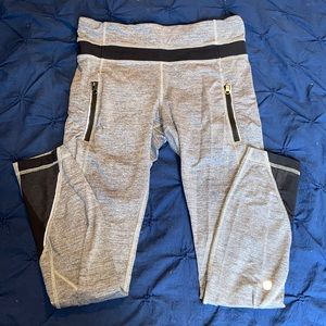 Size 4 Lulu leggings. Gray with black mesh detail. Zipper pockets!